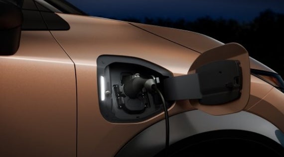Close-up image of charging cable plugged in | Crossroads Nissan Wake Forest in Wake Forest NC
